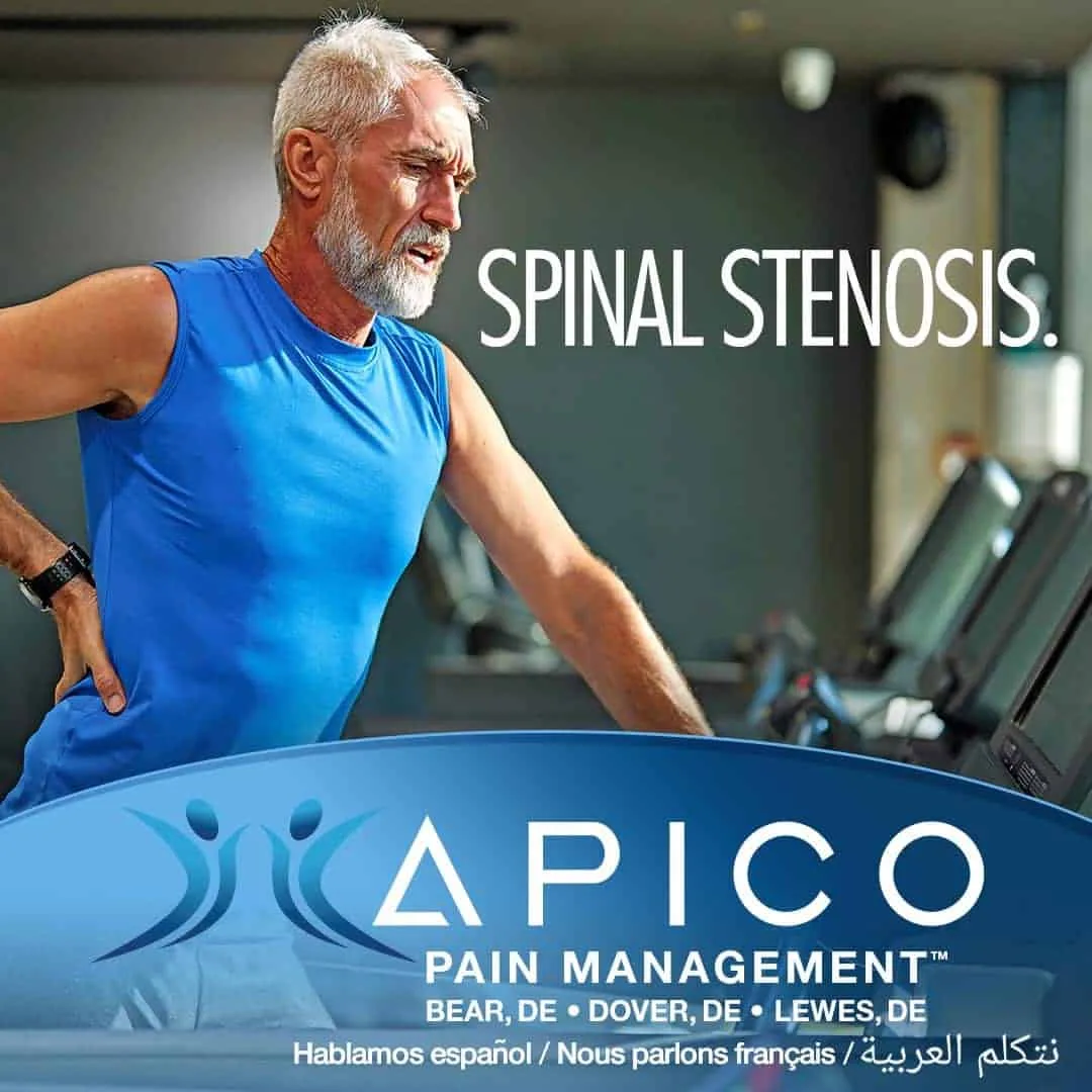 Image of a man exercising, holding his back in pain, possibly caused by spinal stenosis.