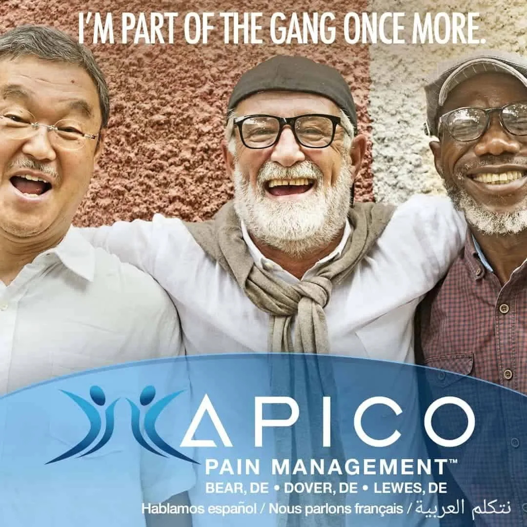 Image of three men smiling arm in arm, because they no longer are restricted by chronic pain. They're back and able to enjoy being with friends!