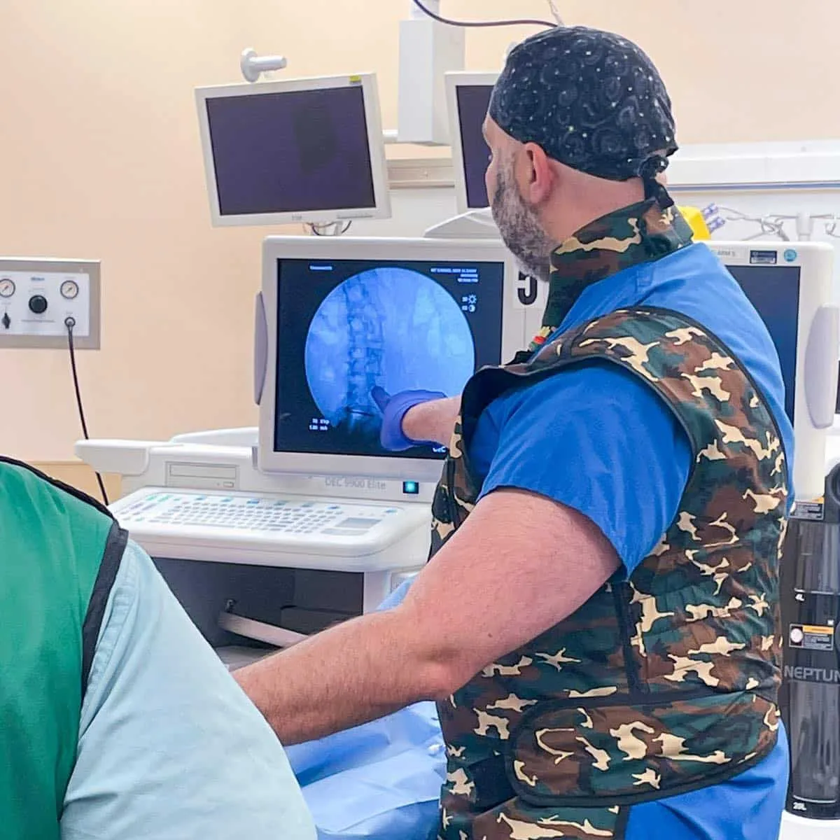 Photo of Dr. Abdallah teaching a new pain managment technique.