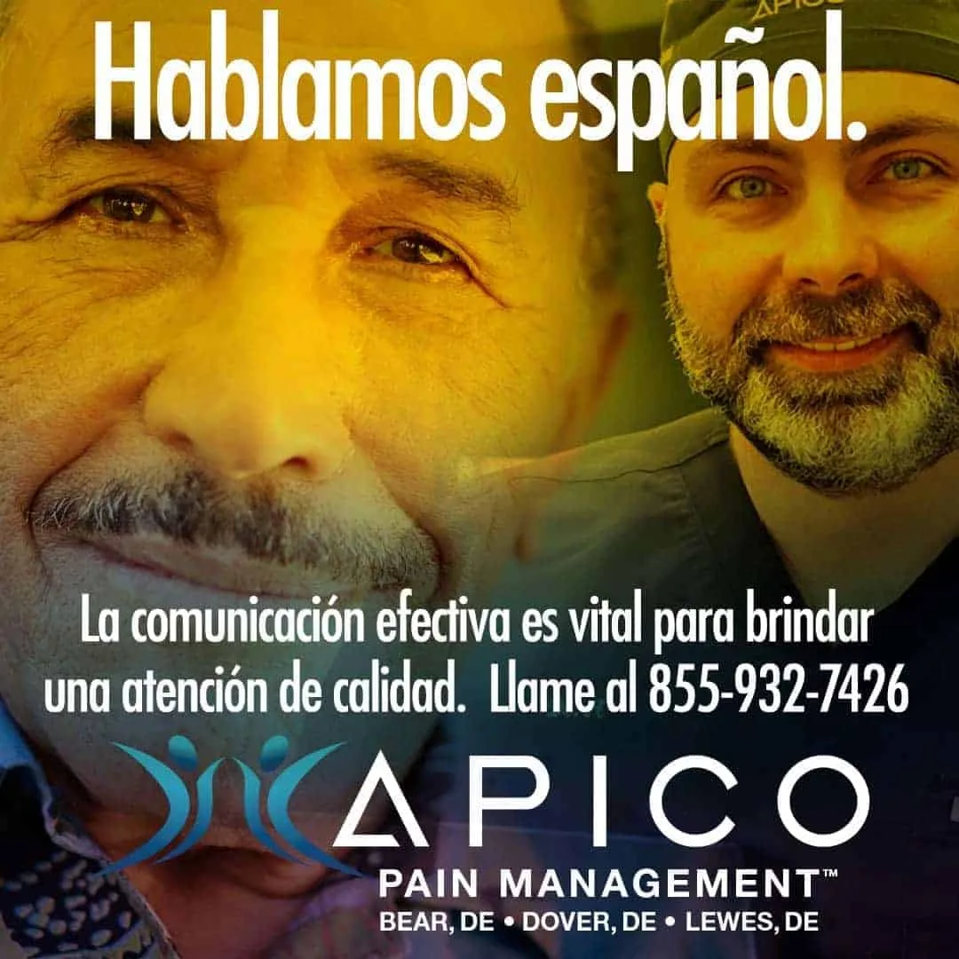 Image of a man smiling, with Dr. Abdallah in the background. Dr. Abdallah speaks fluent Spanish.