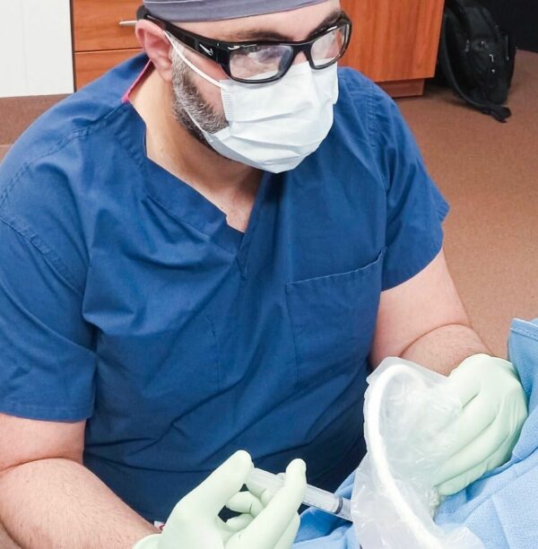 Dr. Abdallah providing treatment to a patientr